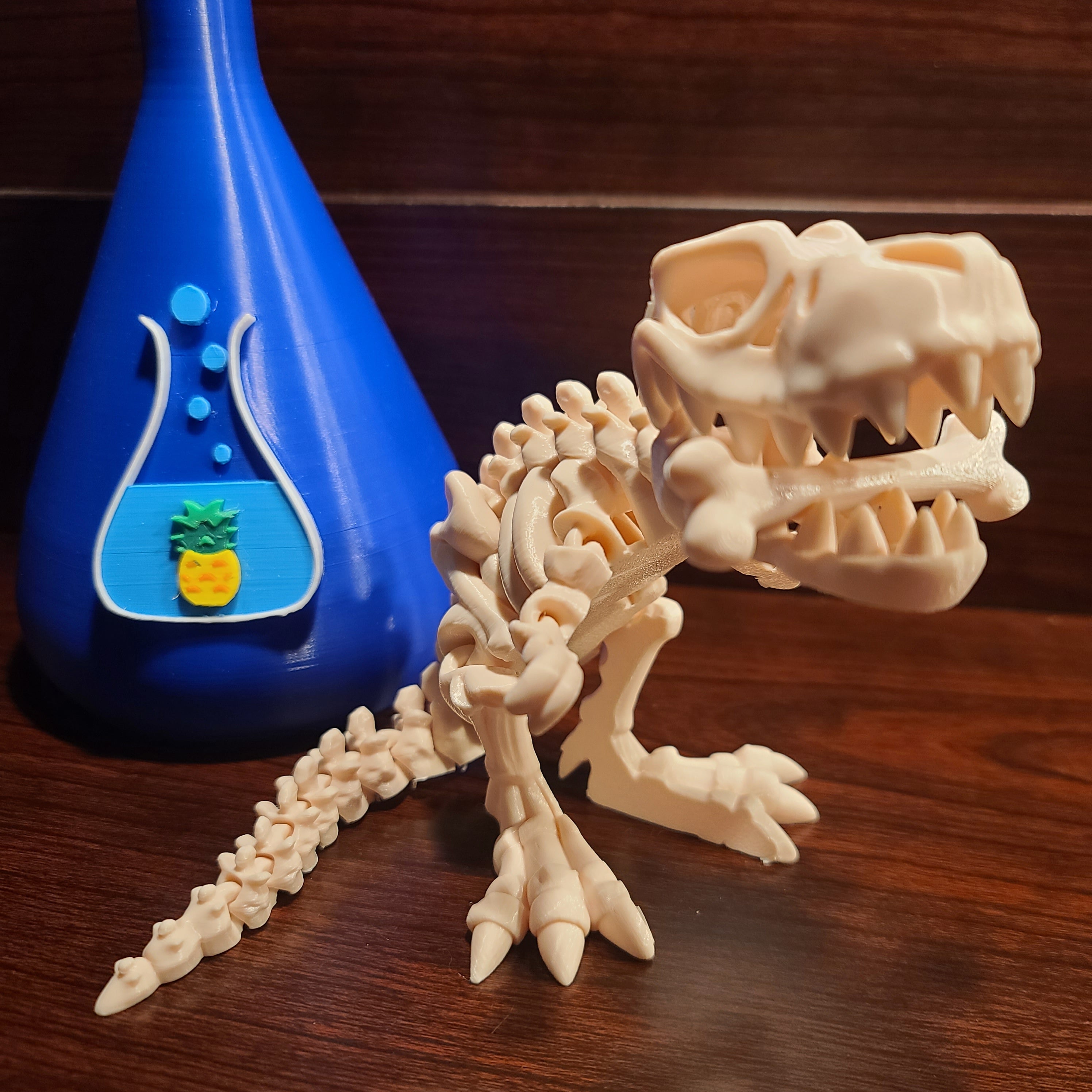 White dinosaur skeleton with a bone in the mouth facing camera. Wood background. Blue beaker with chuganations logo nearby.