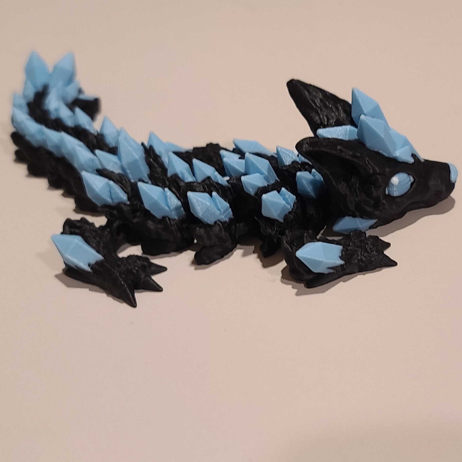crystal wolf dragon tadling youngling with light blue crystals.