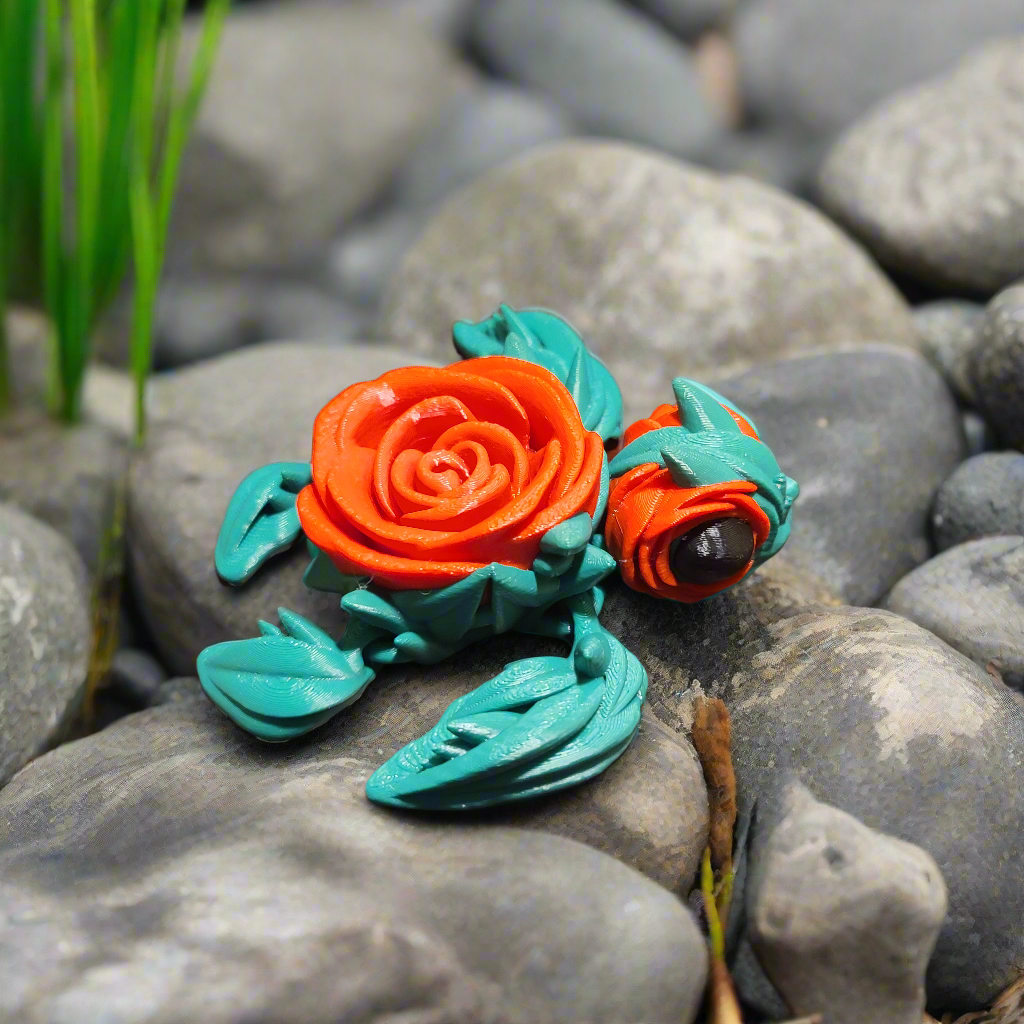 rosurtle fidget, turtle with a rose for a shell, and rose petals around the eyes. Leaves for fins.