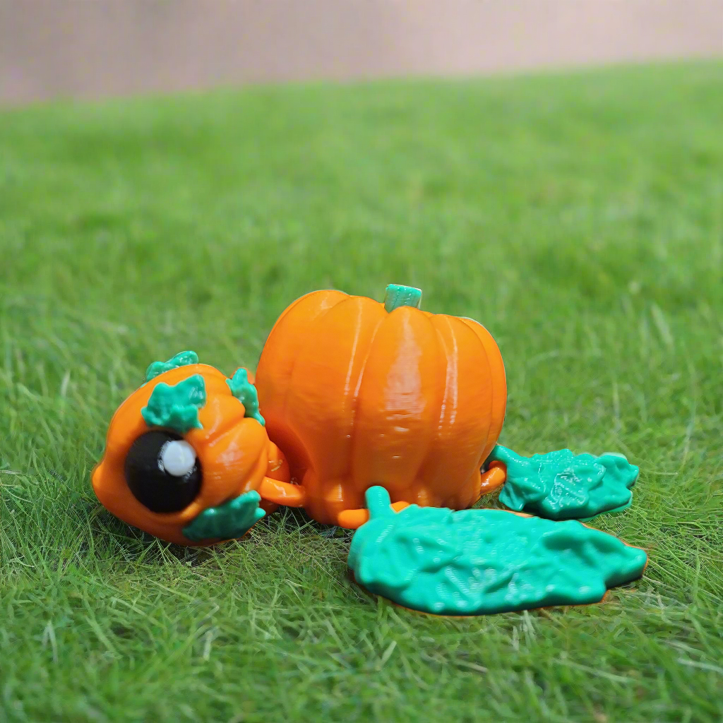 pumpkinurtle fidget, turtle with a pumpkin shaped shell and head, and leaves for the fins.