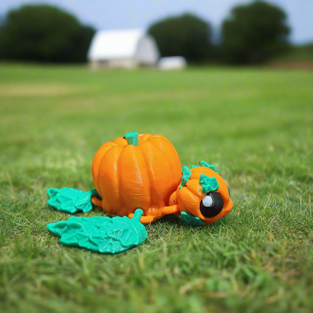 pumpkinurtle fidget, turtle with a pumpkin shaped shell and head, and leaves for the fins.
