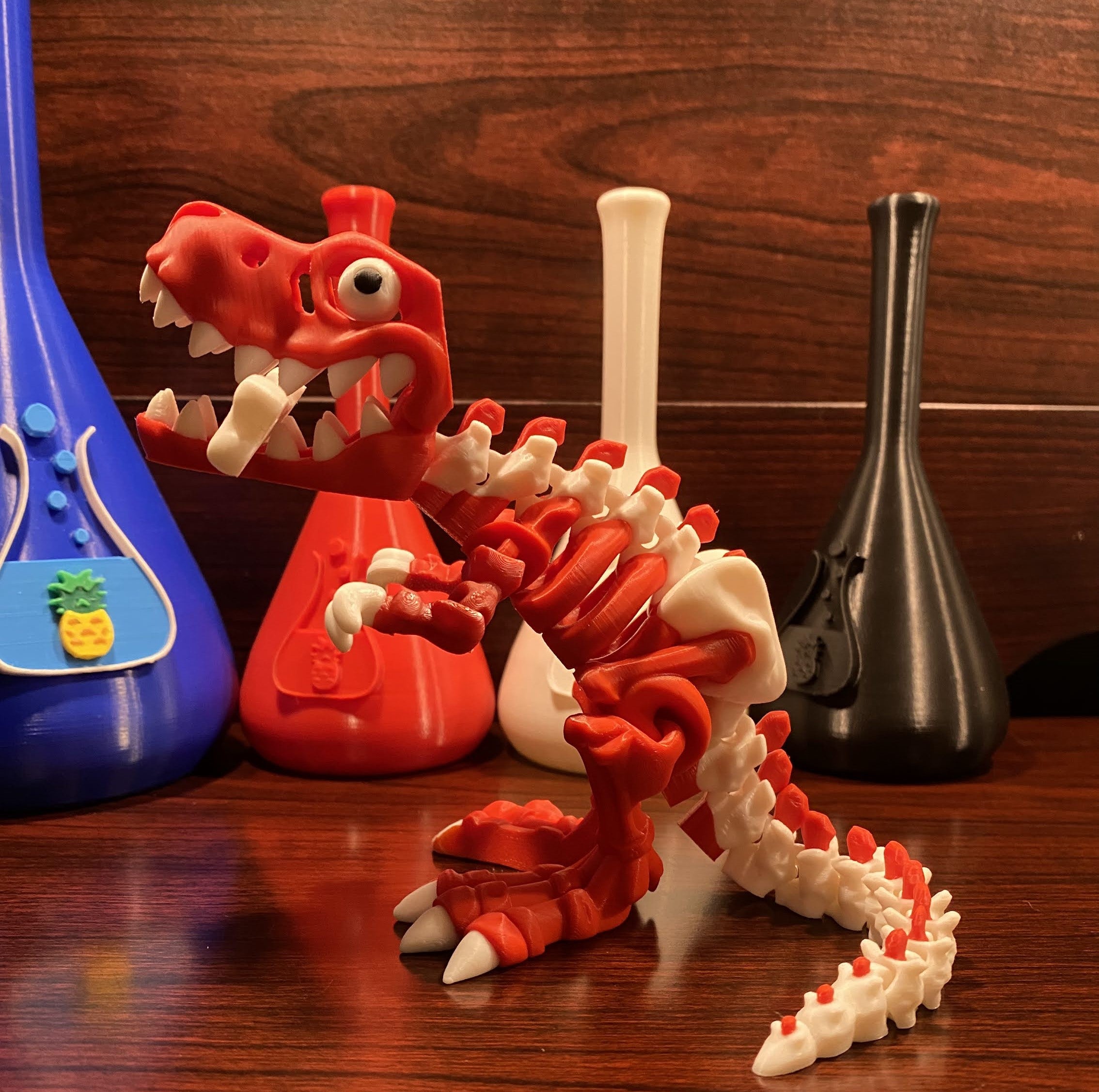 Red and white dinosaurwith a bone in the mouth. Wood background. Various beakers with chuganations logo nearby.
