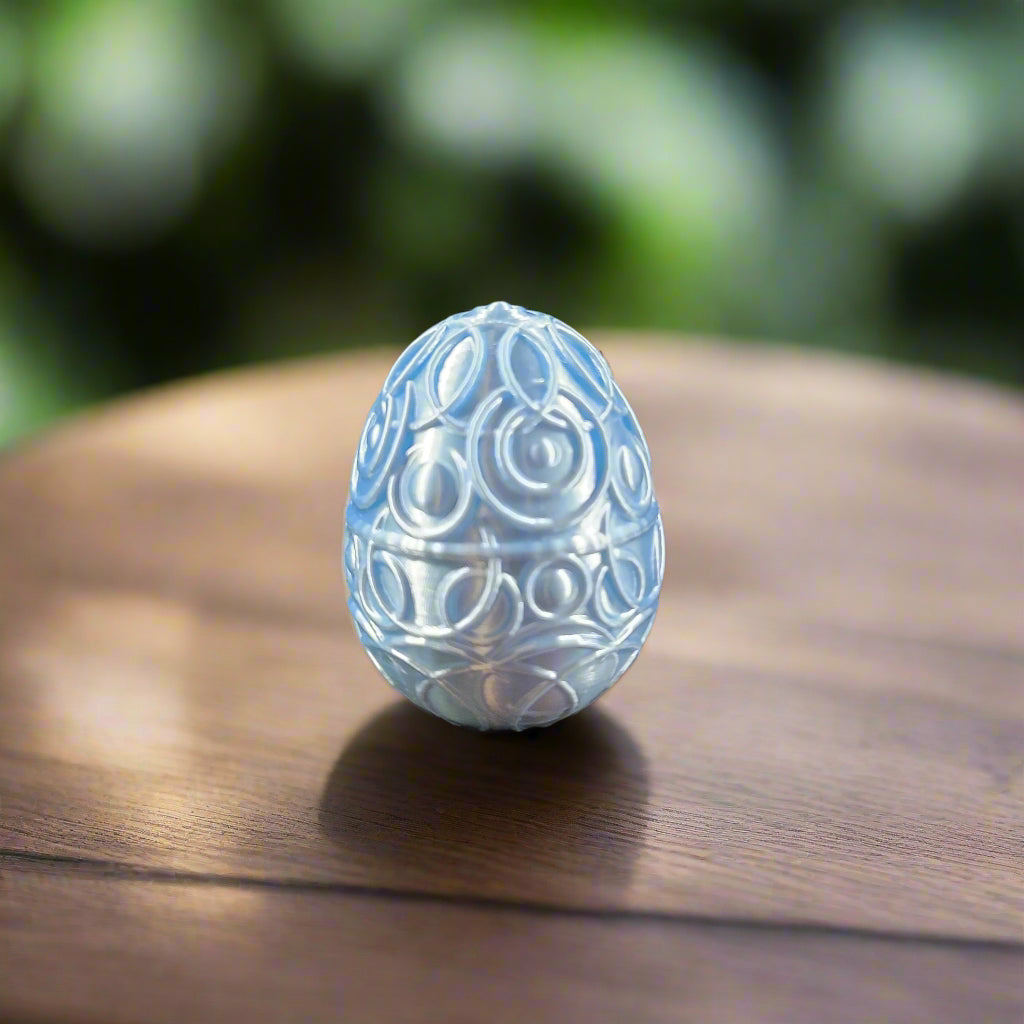 baby blue egg covered with celestial rings