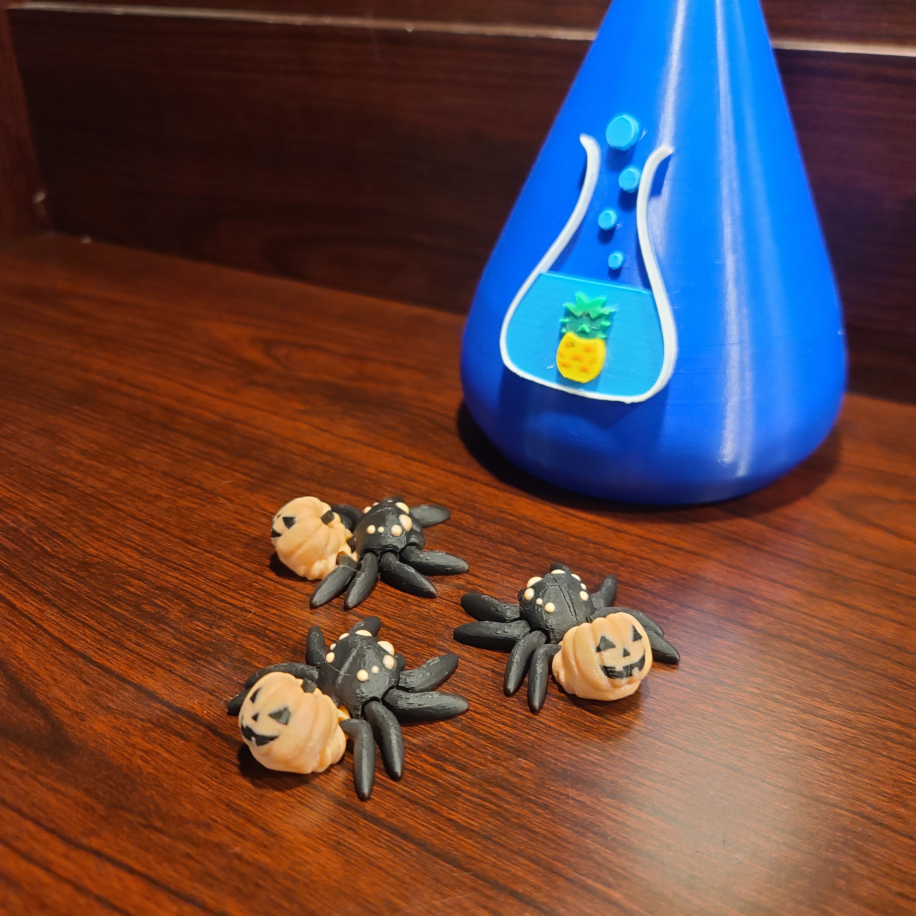 Spiders with pumpkin bodies