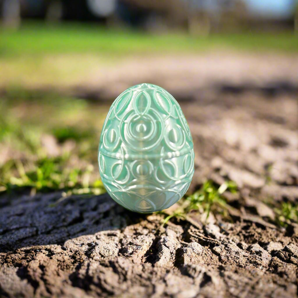 mint green egg with celestial decoration
