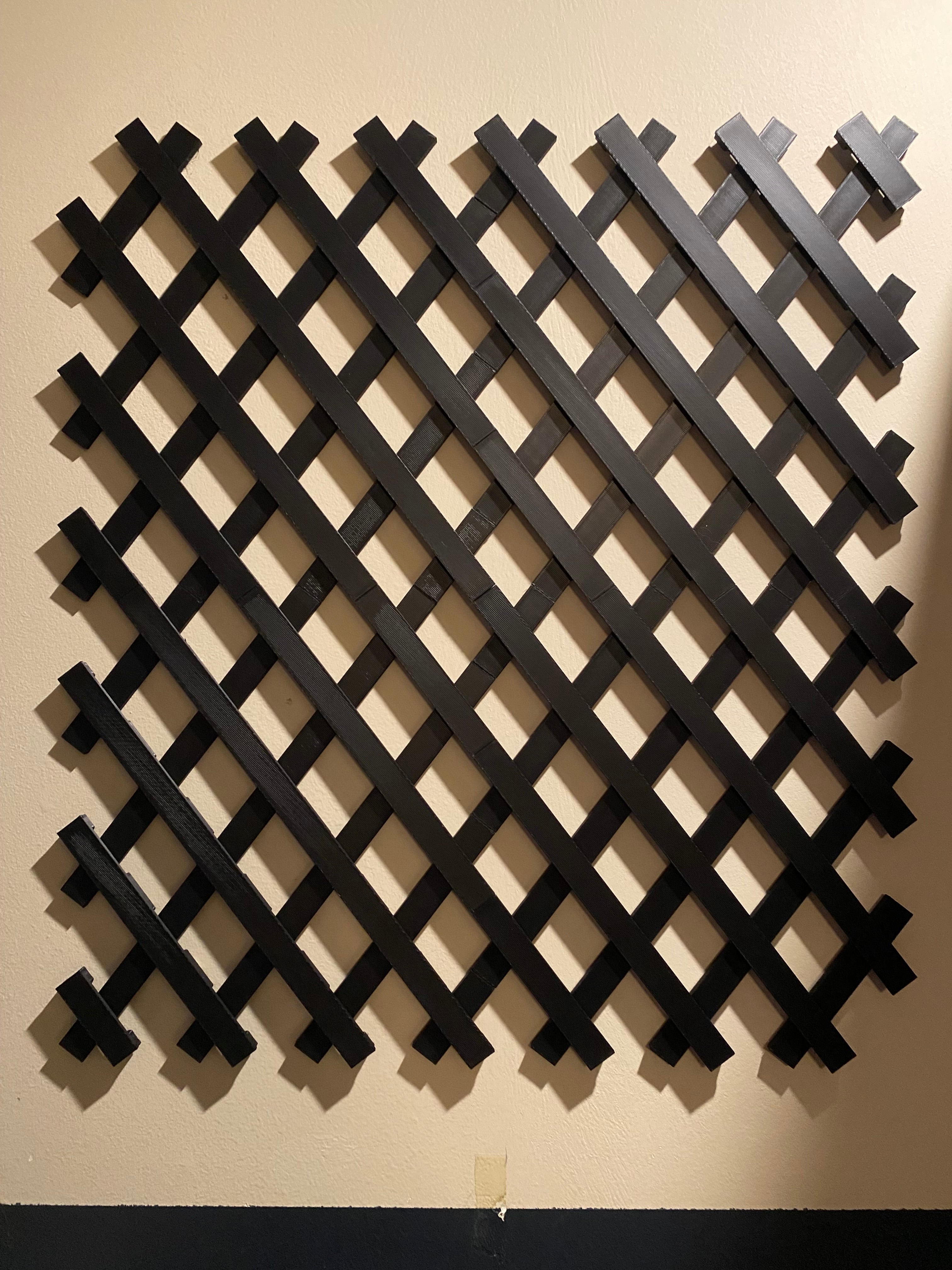 four sections of trellis mounted to a wall. trellis manufactured by chuganations 3d lab