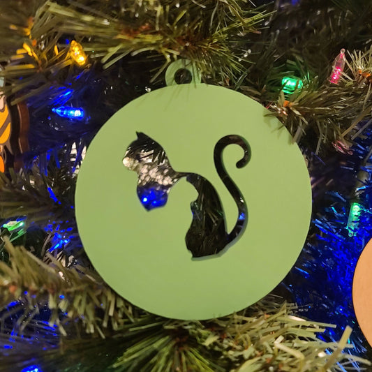 dual cat ornament on a tree