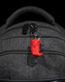 Another ange of the carolina grim reaper keychain manufactured by chuganation's 3d lab. on a backpack but not showcasing the quick clip that comes with the keychain.