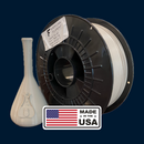 Spool of filament with a vase and 'Made in the USA' label on a dark blue background