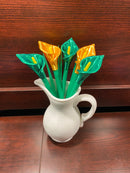 A cala lilly plant pen set inspired by the cala lilly plant. With emerald green and shiny gold flowers. Manufcatured by chuganations 3D Lab in abbeville alabama, located in the united states of america.
