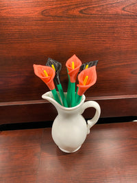 A cala lilly plant pen set inspired by the cala lilly plant. With pink and black flowers. Manufcatured by chuganations 3D Lab in abbeville alabama, located in the united states of america.