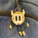 cookie shaped keychain wearing a cute mask. 