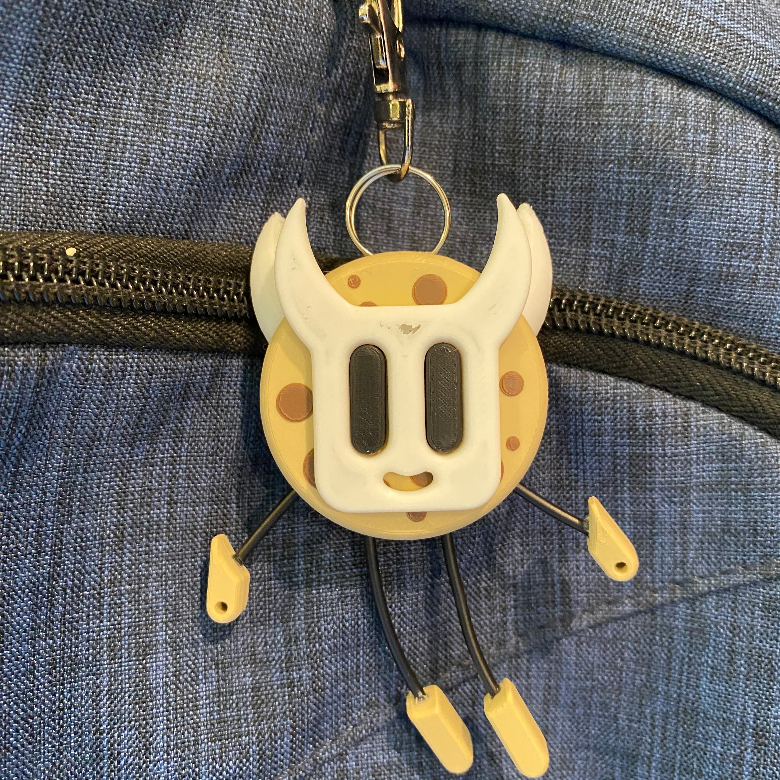 Cookie Shaped Keychain wearing a mask.