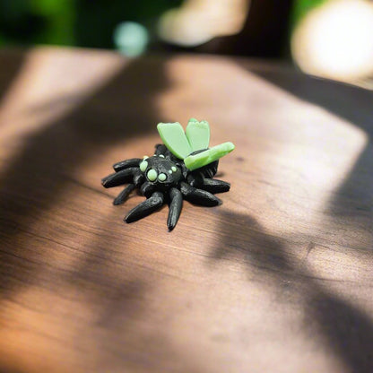 spider with fairy butterfly wings on a walnut table in the jungle