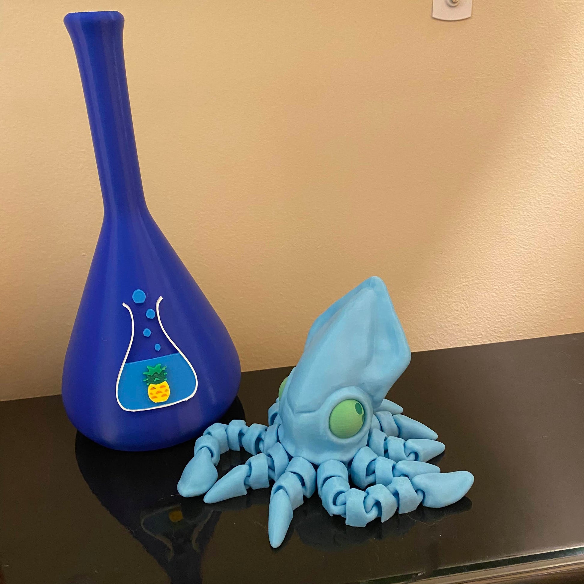 blue squid fidget on a black shelf