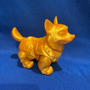 A golden terra guardian fidget standing on a blue tablecloth. The fidget is manufactured by Chuganation's 3D Lab. 